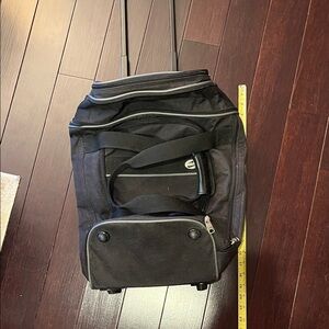 American Tourister Black Rolling Travel Bag